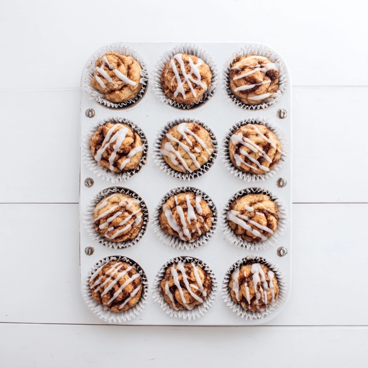 Baked Cinnamon Roll Protein Muffins showing moist crumb; perfect grab-and-go breakfast treat.