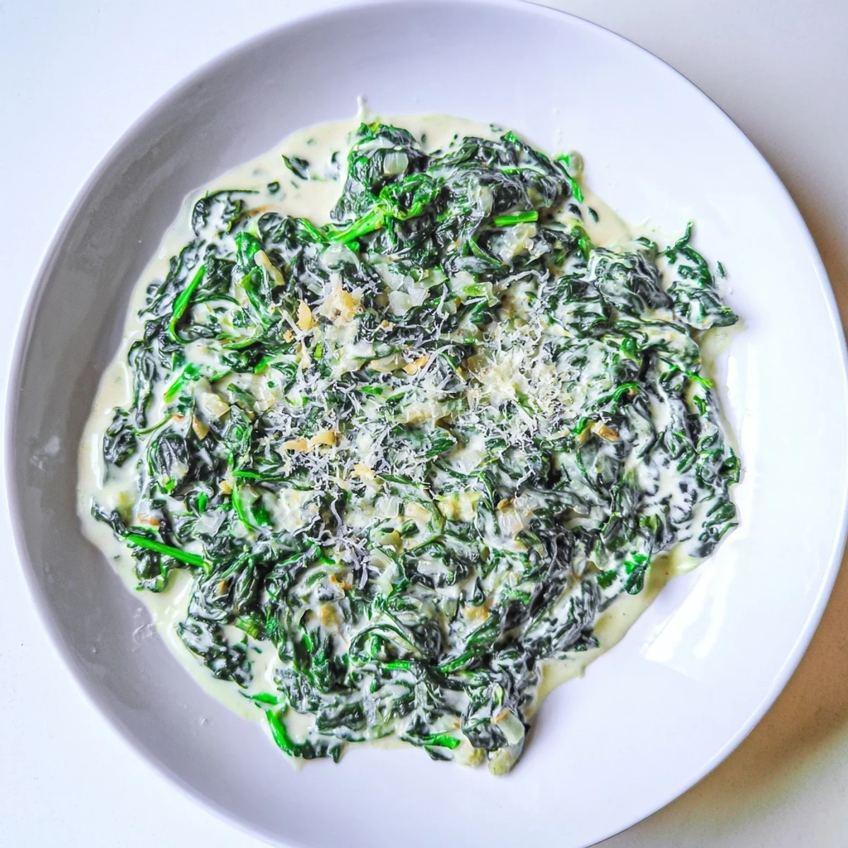 Close-up of freshly made Creamy Spinach, ready to serve as a flavorful side dish at dinner tonight.