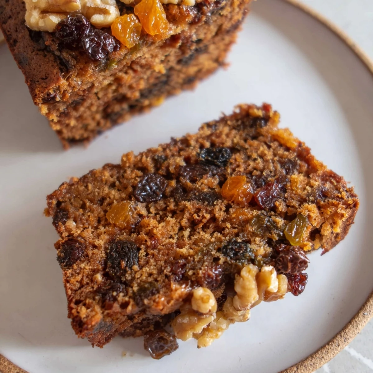 Warm spices and dried fruits create the delicious flavor of this moist Fruit Spiced Cake, ready to serve and enjoy.