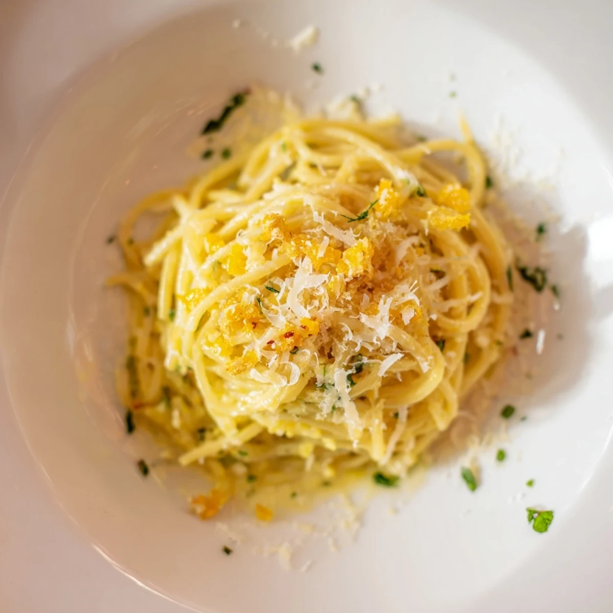 Steaming Pasta Garlic with shiny strands of spaghetti coated in fragrant garlic oil and parsley.