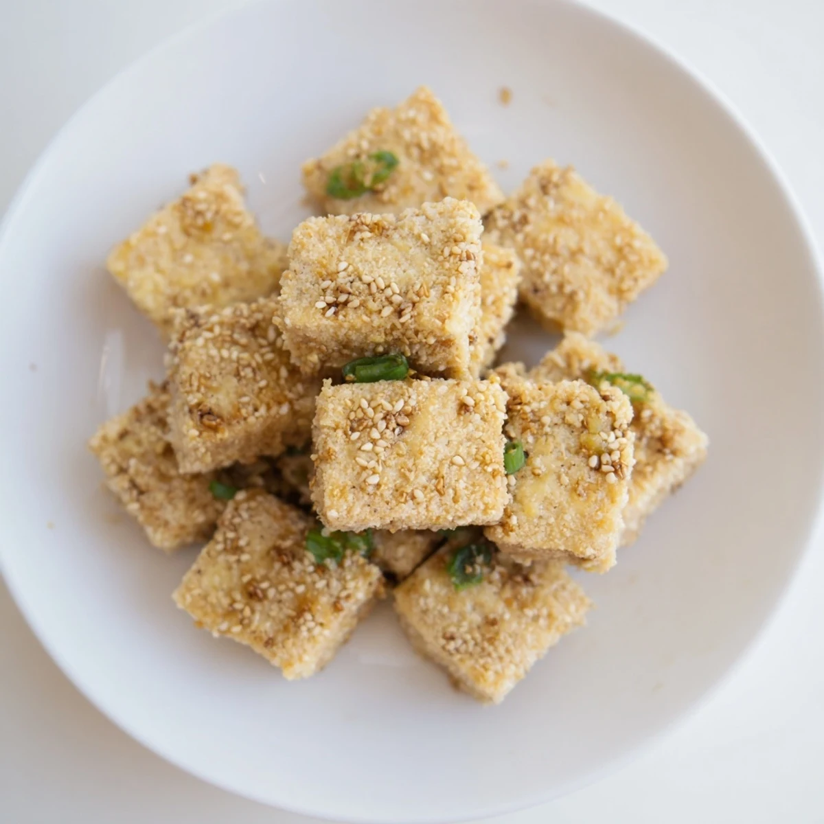 Imagine perfectly fried Crispy Tofu, warm and crunchy, served with a flavorful dipping sauce.