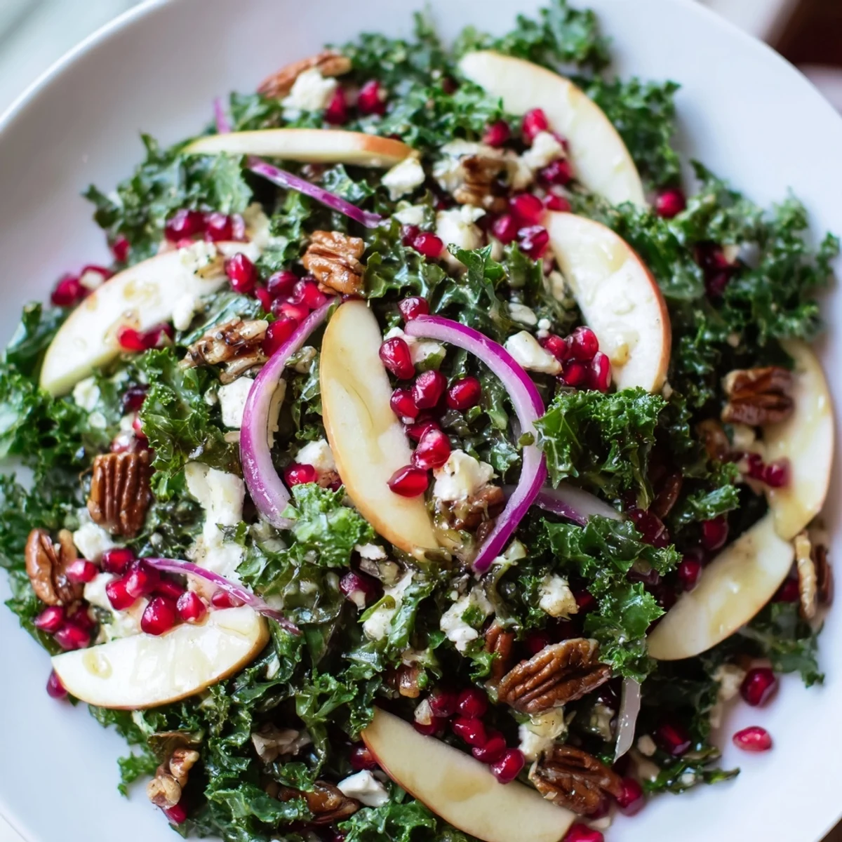 Tender kale and juicy pomegranate mingle in this colorful Winter Kale Salad, drizzled with citrus dressing.
