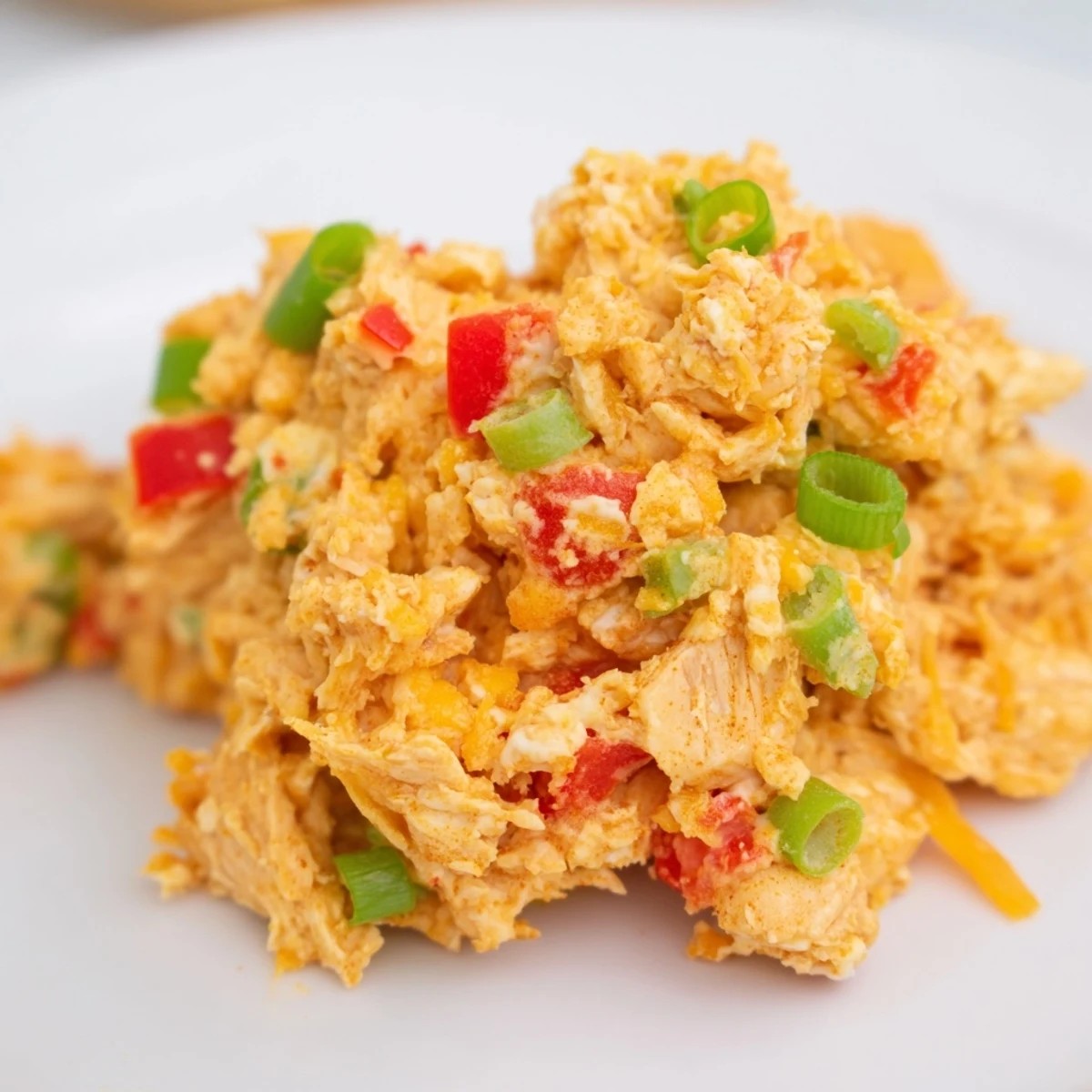 Freshly baked Chicken Treat Bites served warm on a wooden board with honey mustard dip.