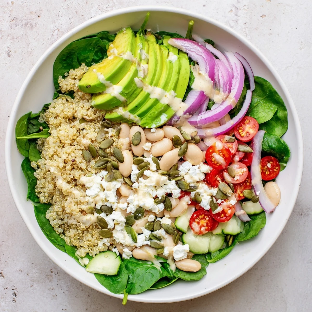 Served in a rustic ceramic bowl, this nutritious vegetarian meal offers a hearty texture with diced cucumber and red onion.