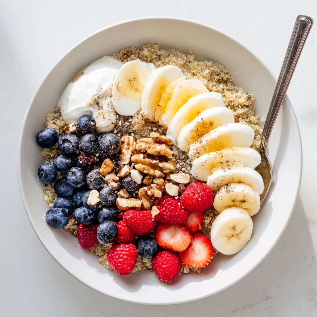 Enjoy the Dietitians Balanced Breakfast Bowl with fresh berries, eggs, and chia seeds, ready to drizzle with honey.