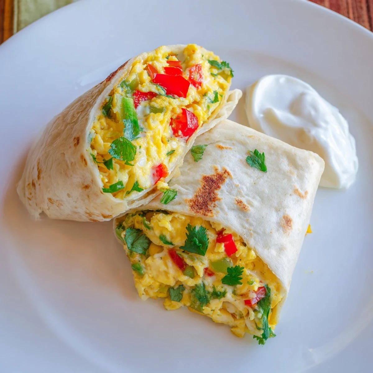 A close-up shows the folded Tex Mex Egg Tortilla Pocket, with melted cheddar and juicy cherry tomatoes peeking out, perfect for a quick handheld brunch.
