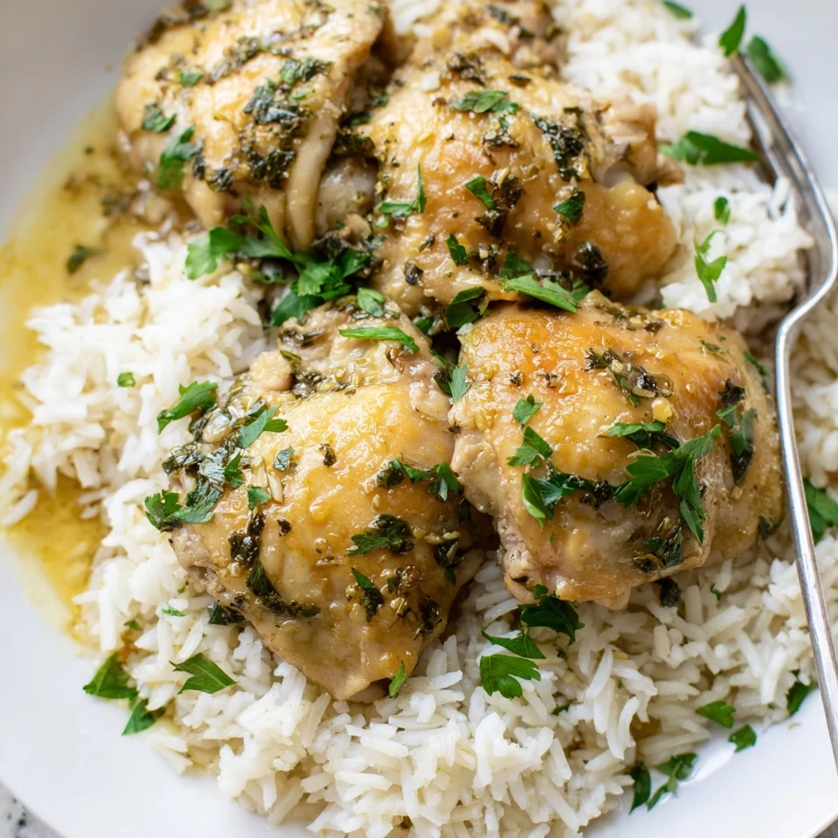 Slow Cooker Lemon Herb Chicken With Fluffy Rice features juicy, tender chicken in a bright citrus sauce.