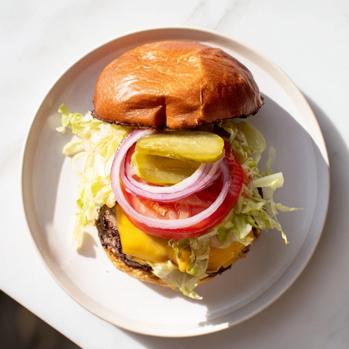 Hand-pressed juicy smash burger stacked with fresh lettuce tomatoes and tangy pickles