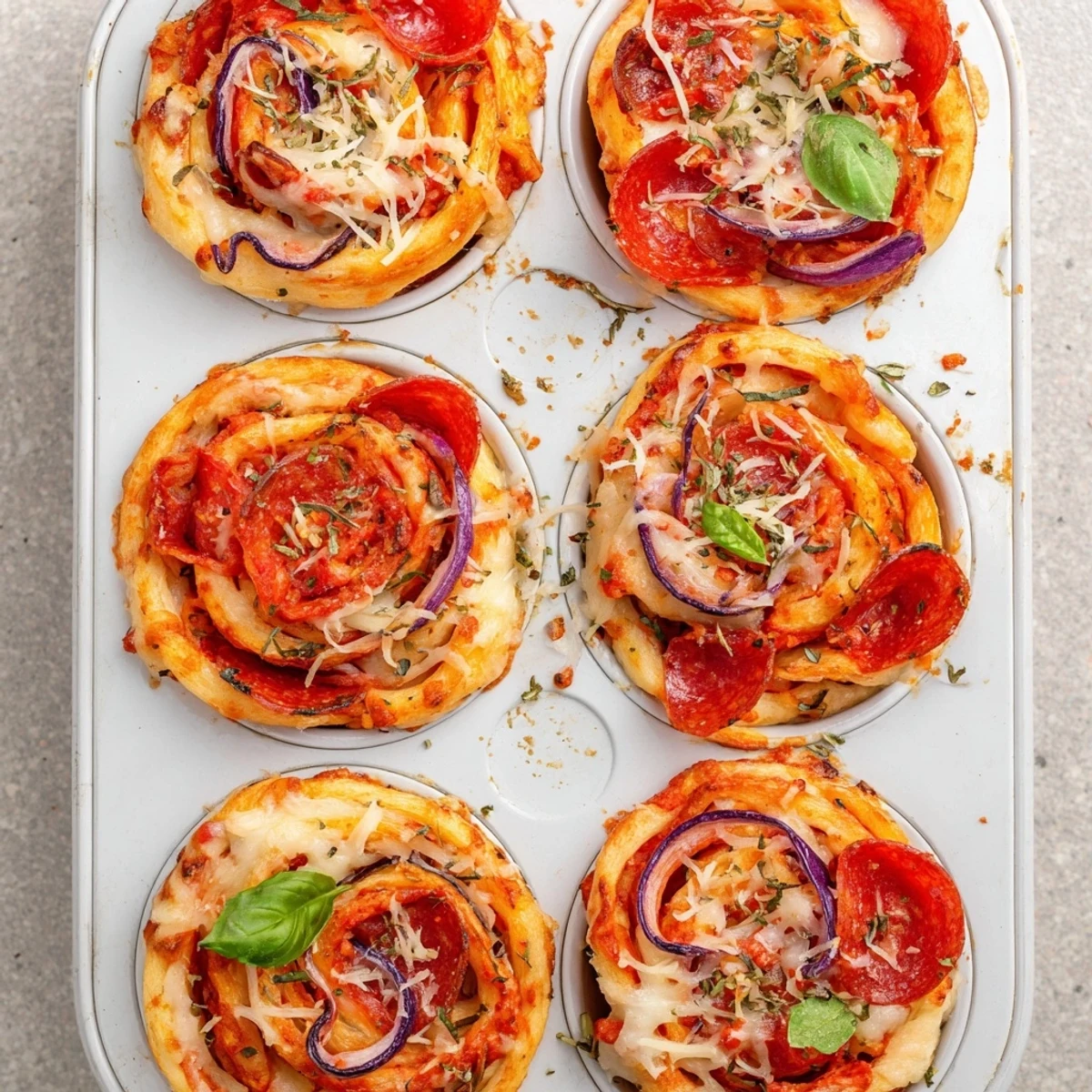 Flower-shaped easy pizza roses topped with colorful peppers and red onion slices