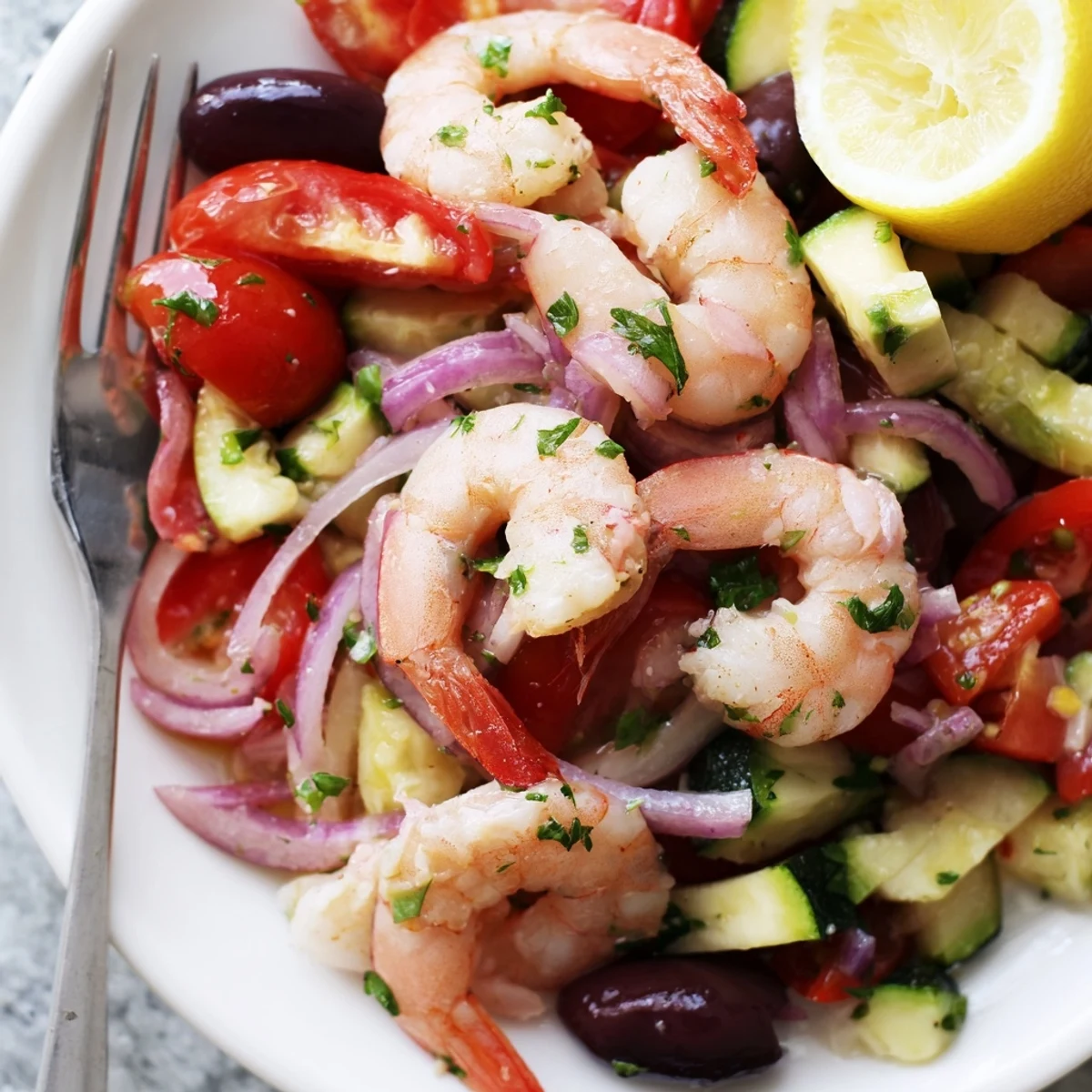 Golden seared Mediterranean shrimp skillet with cherry tomatoes and Kalamata olives