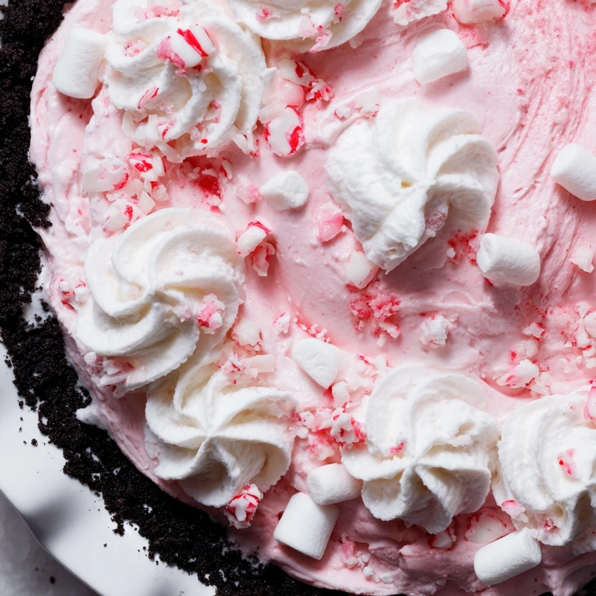 Candy Cane Pie with creamy peppermint filling and crunchy chocolate-cookie crust