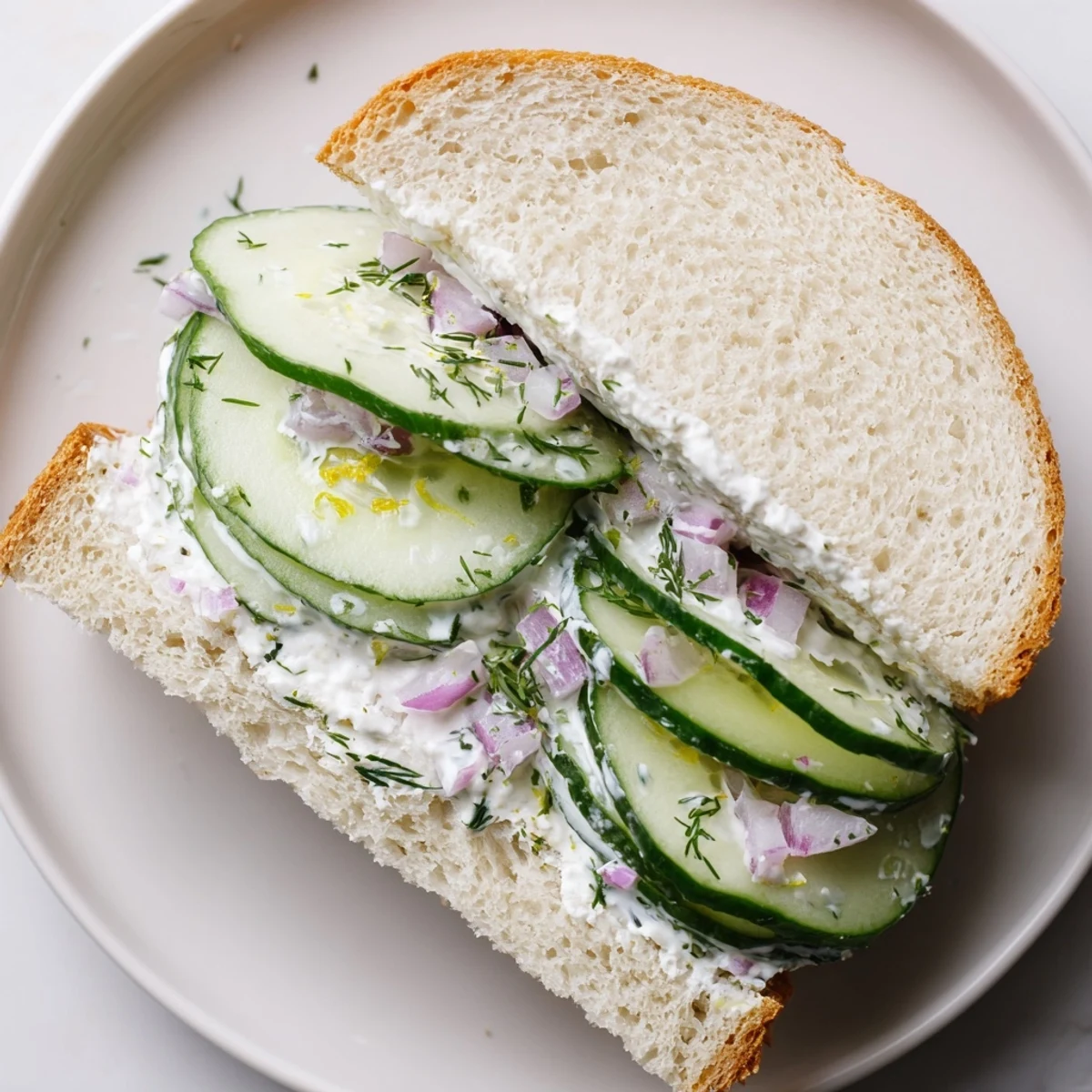 Quick Cucumber Salad Sandwiches with creamy dill dressing on soft buttered bread.
