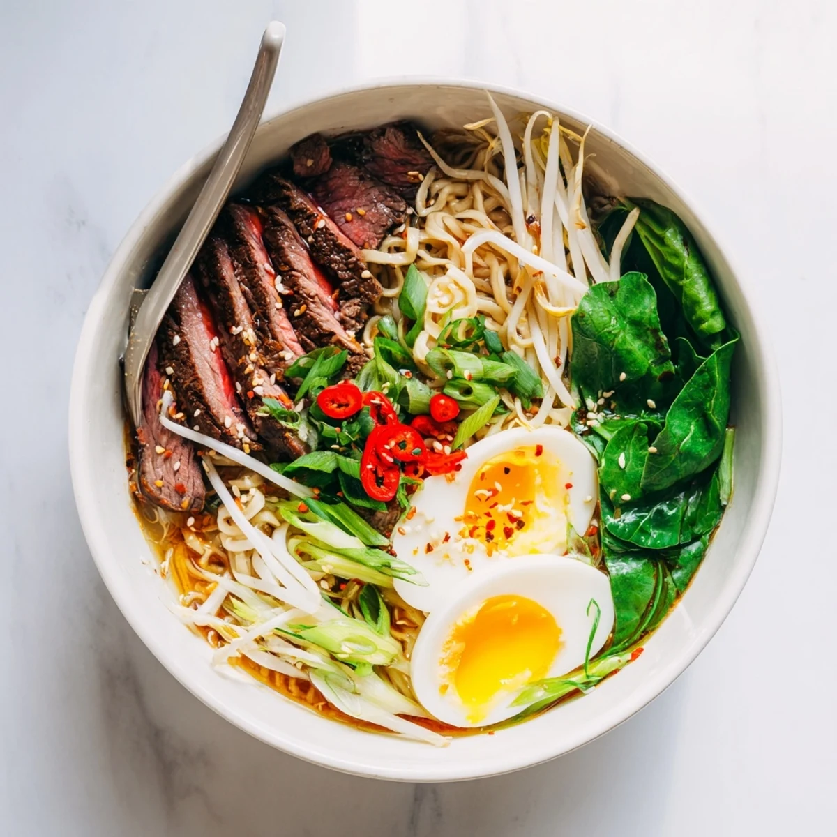 Creamy garlic sauce drizzled over tender sliced beef in a rich Japanese fusion ramen bowl