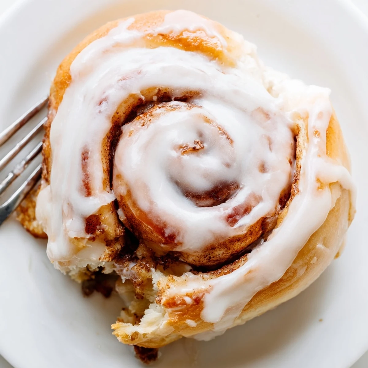 Homemade banana cinnamon rolls arranged in a baking dish ready for breakfast serving