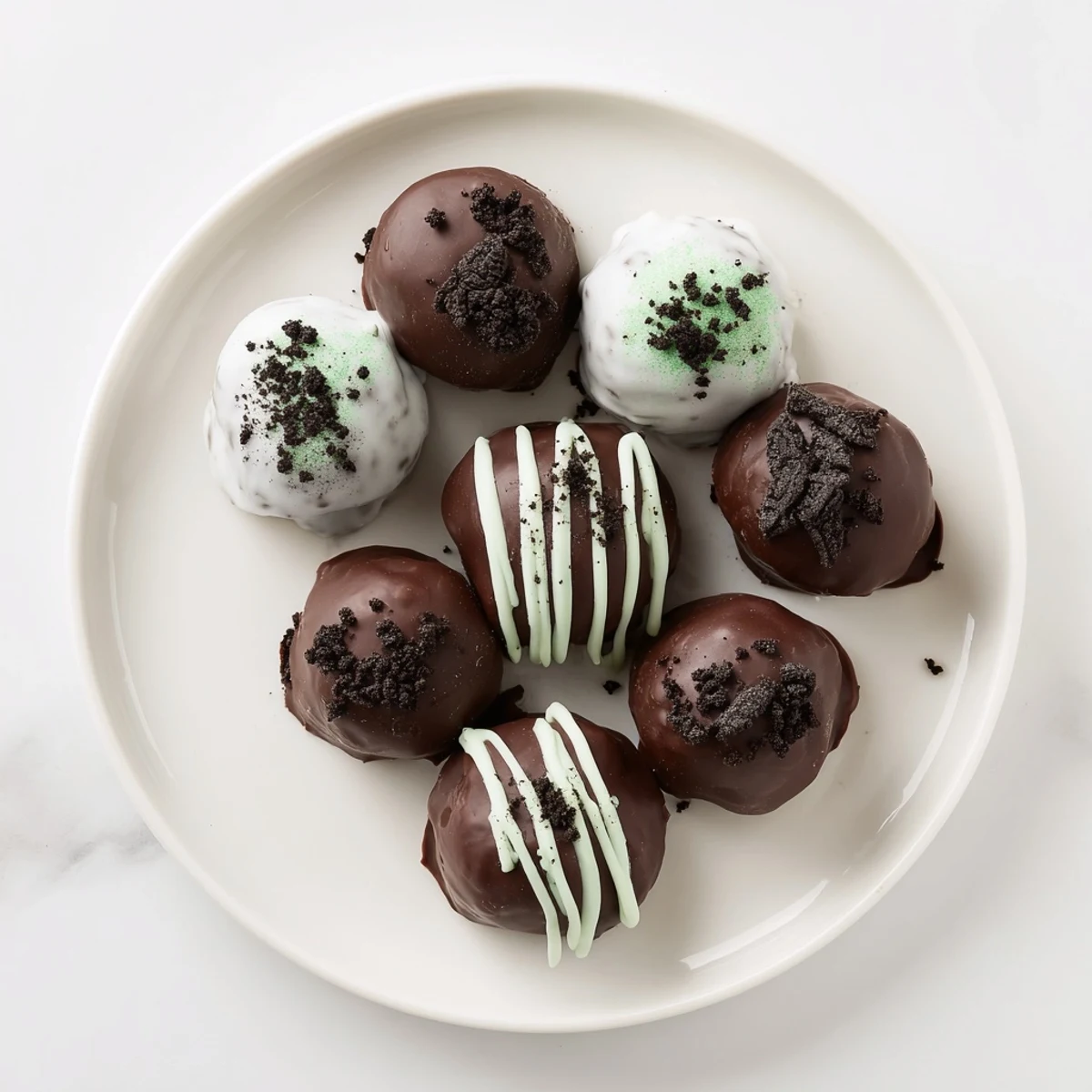 Rich chocolate-dipped mint Oreo truffles arranged elegantly for party dessert serving