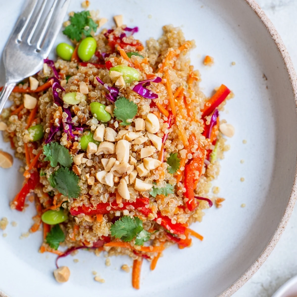 Bright Asian Dressing Quinoa Salad tossed with cilantro, peanuts, and lime