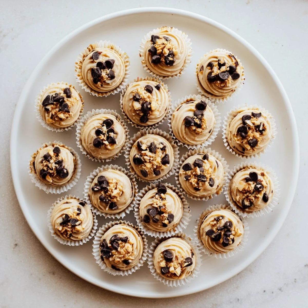Creamy high protein frozen peanut butter Greek yogurt bites in a silicone muffin tin ready for freezing