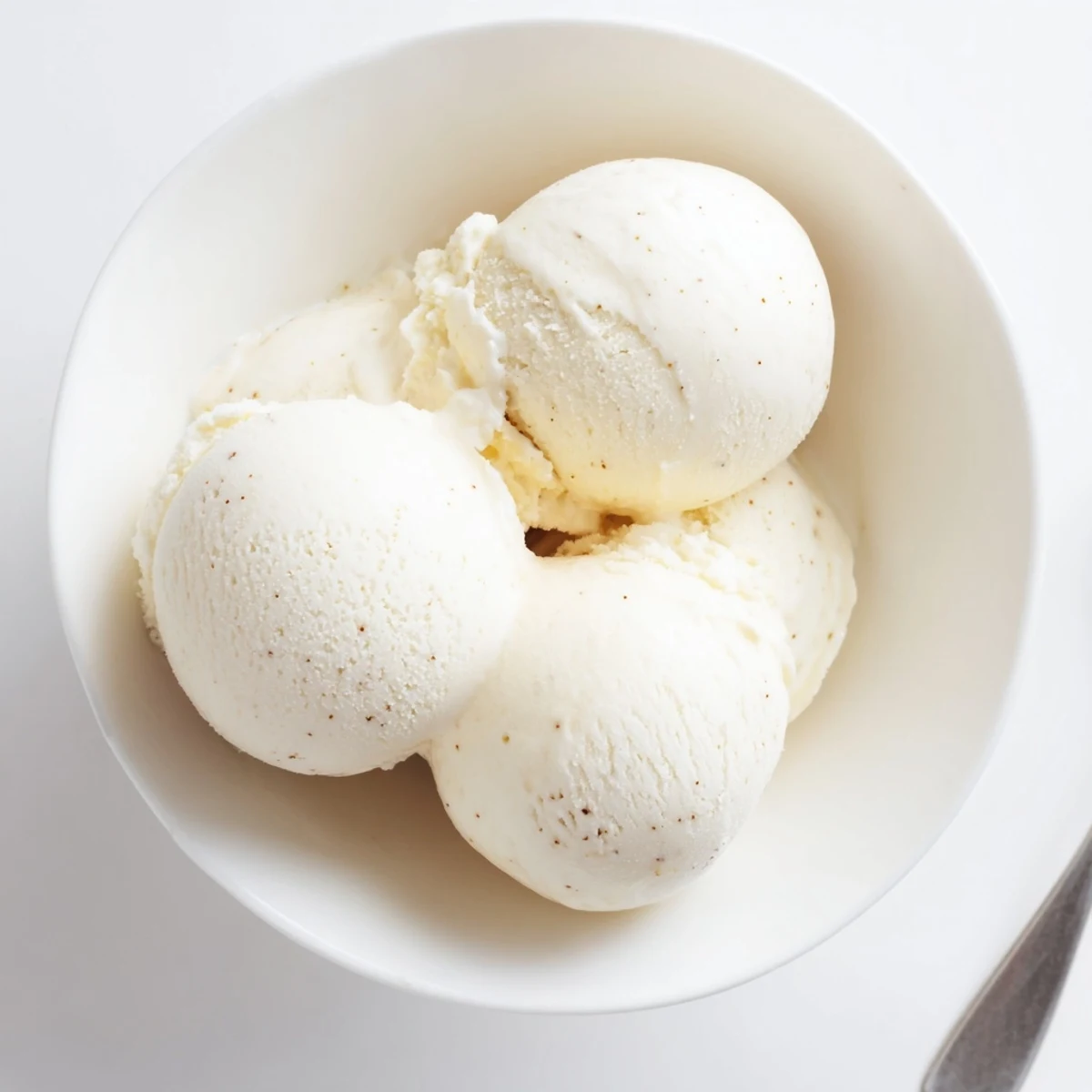 Rich vanilla ice cream recipe with custard base freshly churned to velvety perfection