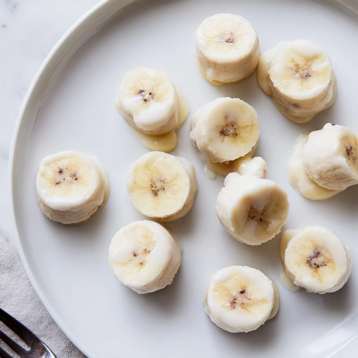 Tray of Frozen Banana Yogurt Bites cooling in freezer, bite-sized, refreshing