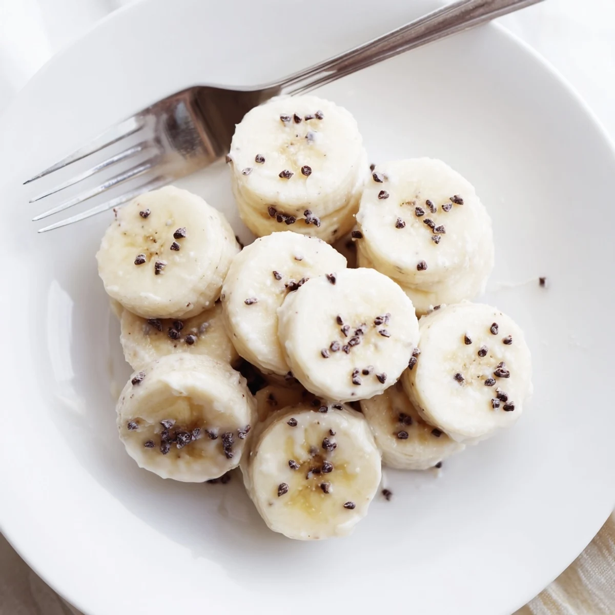 Homemade Frozen Banana Yogurt Bites taste creamy with coconut and crunchy nuts