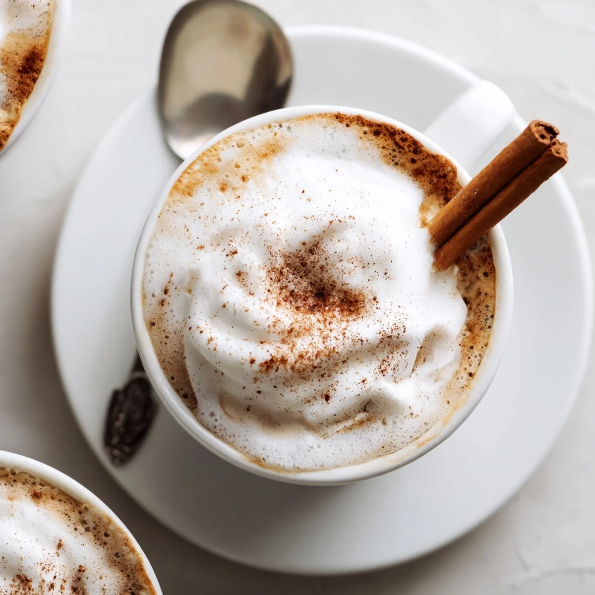 Cozy Winter Lattes served alongside gingerbread cookies, warm spice aroma visible