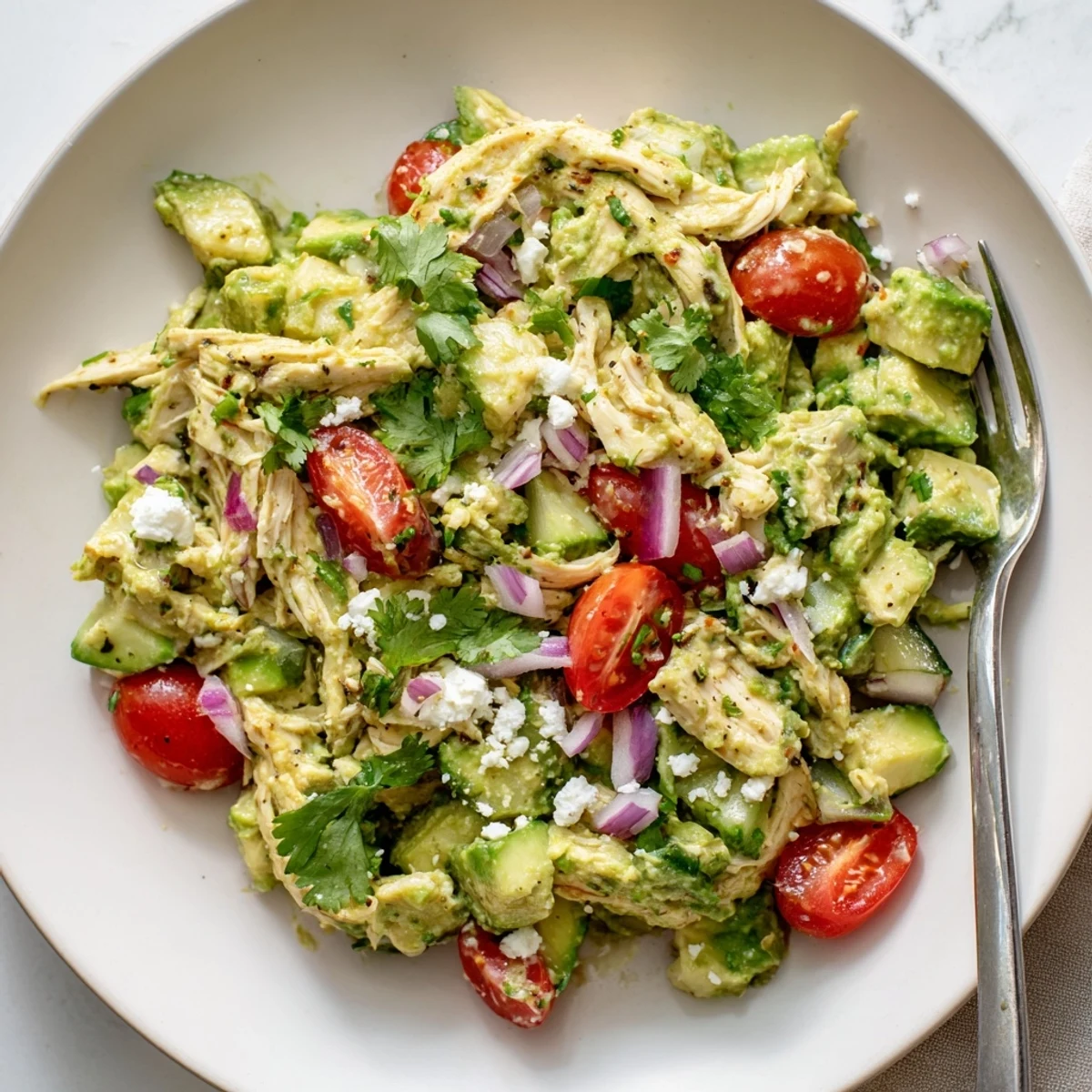 Picnic-ready Avocado Chicken Salad served in lettuce wraps, bright cilantro aroma