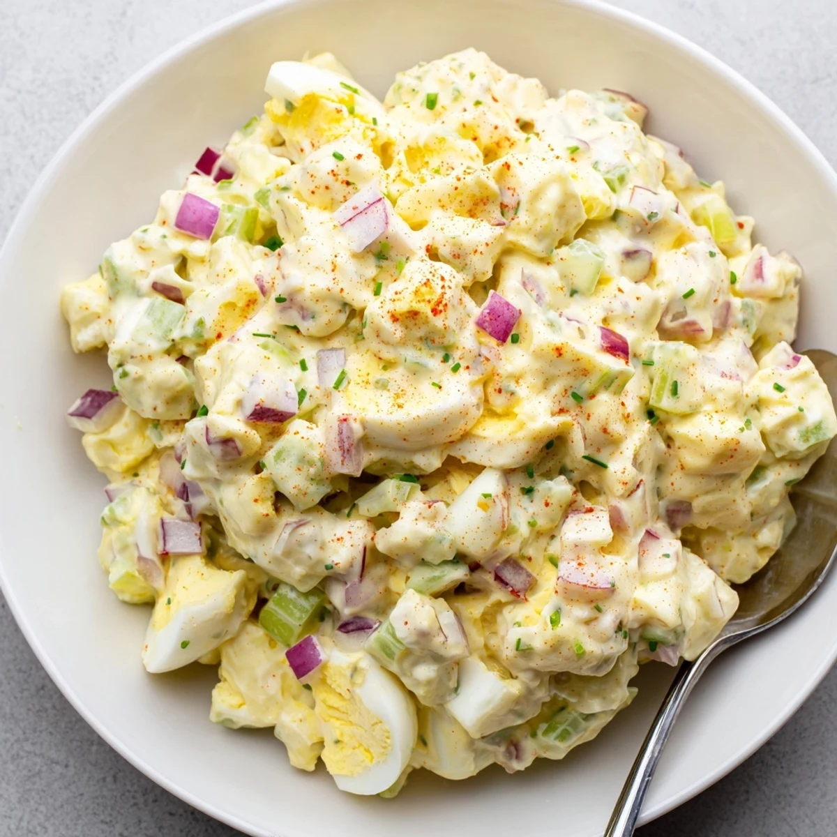 Classic Egg Salad Recipe with creamy mayo, crunchy celery, and paprika garnish