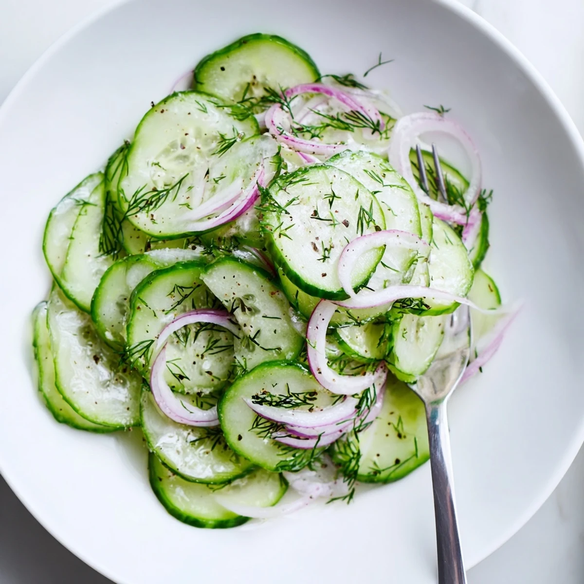 Cucumber Salad with thinly sliced cucumbers and dill, chilled, crisp summer side