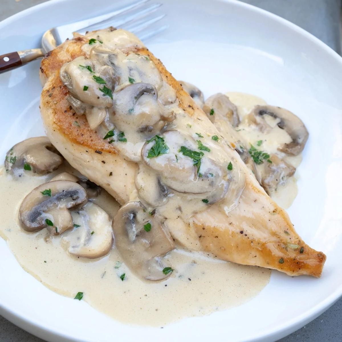 Juicy Skillet Chicken And Mushroom Sauce with browned mushrooms, garlic aroma filling kitchen.