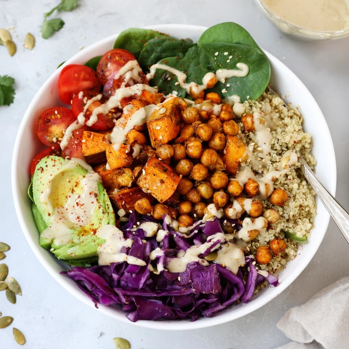 Hearty Buddha Bowl layered with quinoa, roasted vegetables, and sesame seed topping