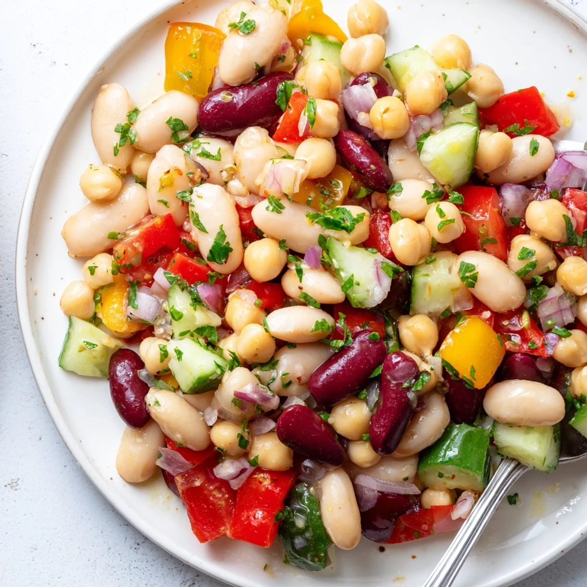 Colorful Italian bean salad tossed with crisp bell peppers and tangy vinaigrette