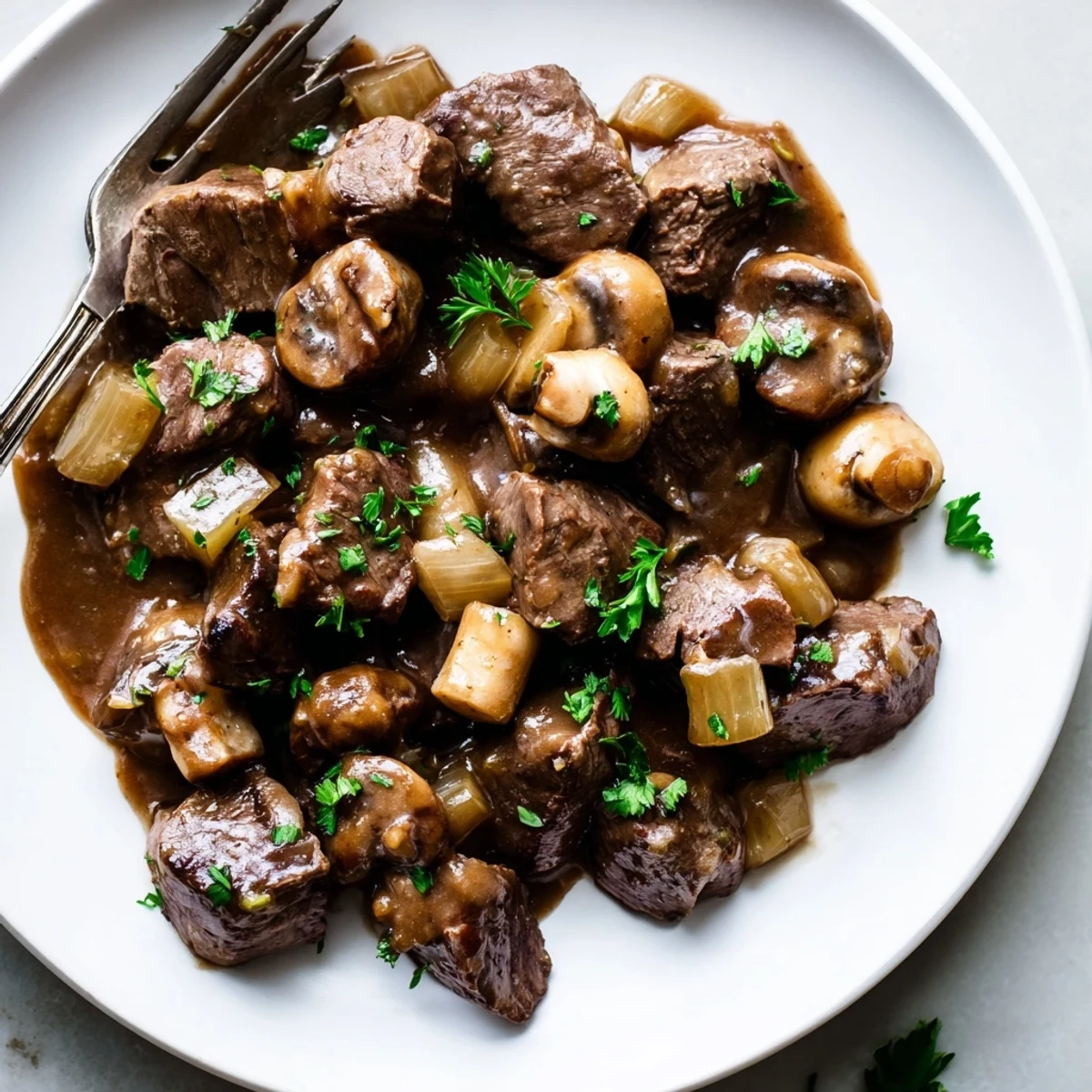Savory weeknight steak tips and gravy served in a cast iron skillet