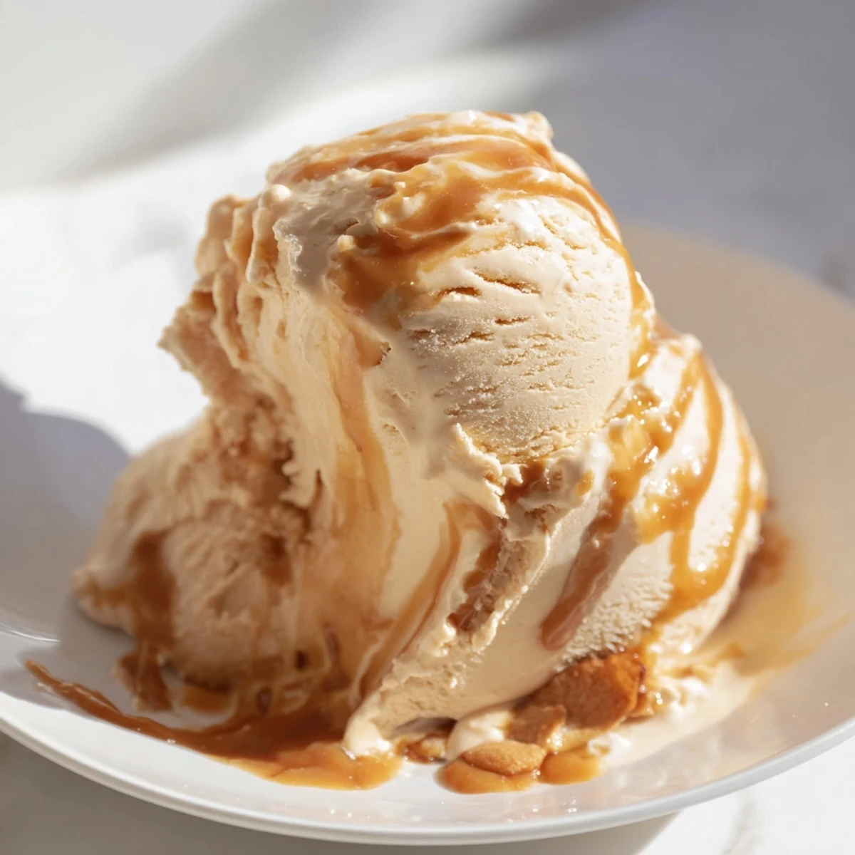 Smooth halal-friendly salted caramel ice cream showing soft scoops ready for dessert serving