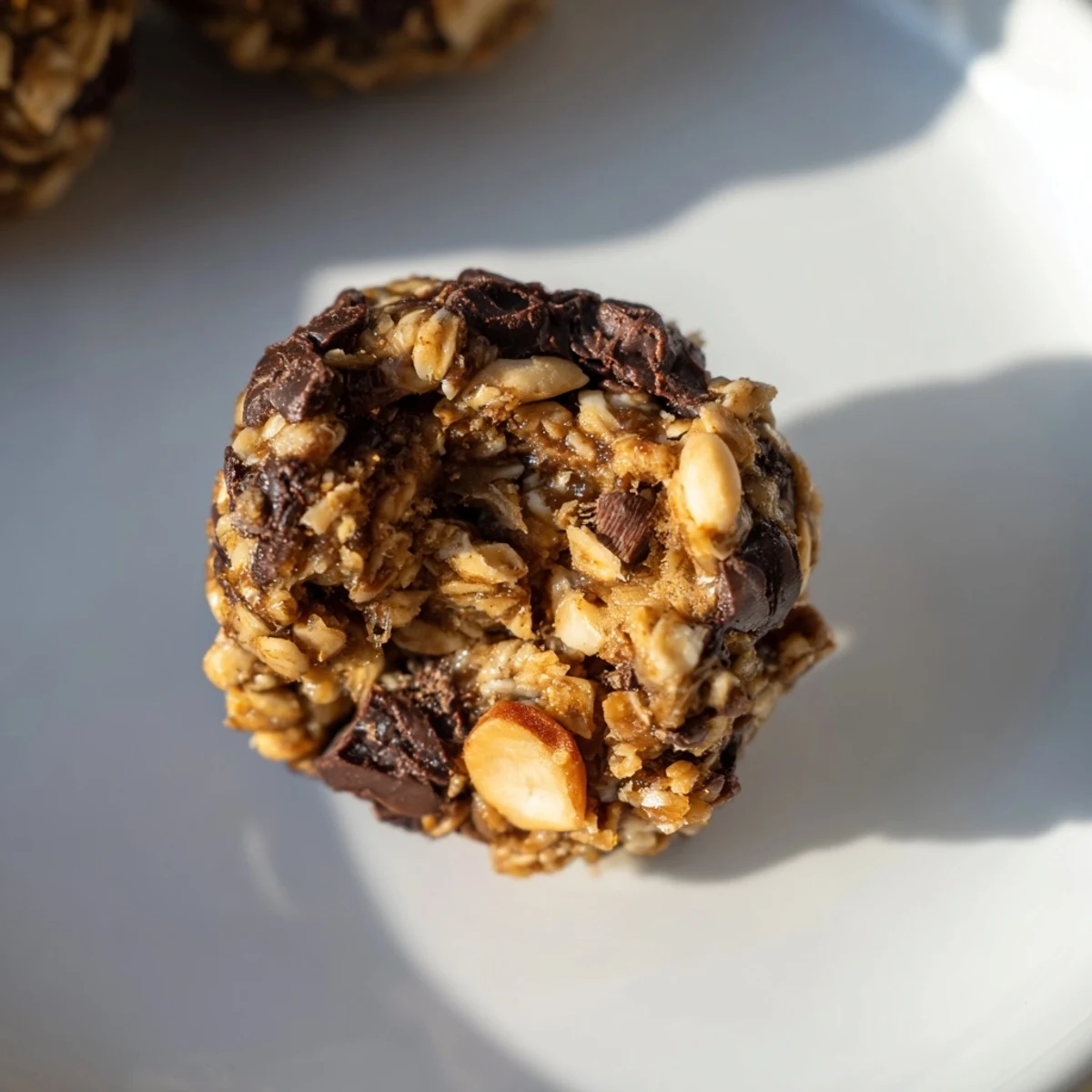Rich chocolate Snickers energy balls with crunchy peanuts and creamy peanut butter.  