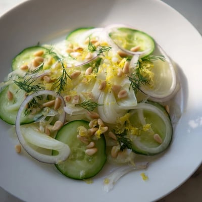 Thinly sliced fennel and cucumber tossed in a light citrus vinaigrette.  