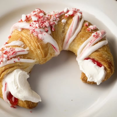 Golden candy cane crescent filled with sweet cream cheese and strawberry preserves  